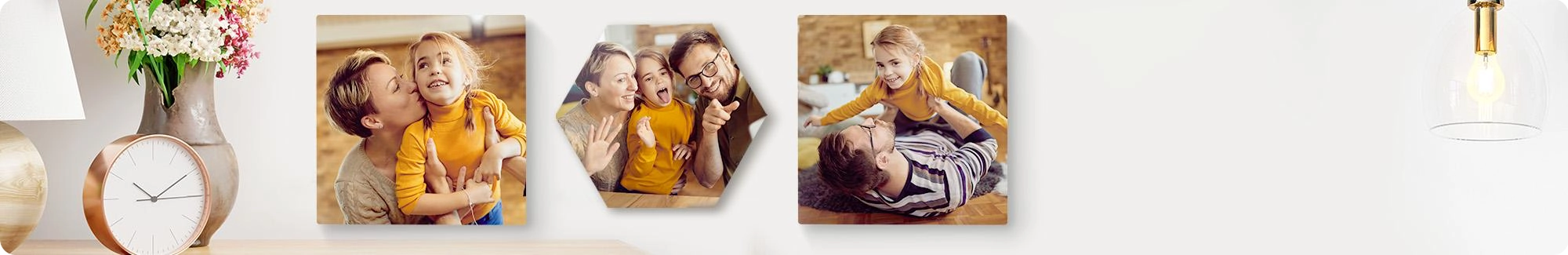 Snapfish Photo Tiles featuring child portraits, family photos, and vacation photos displayed on wall above a sofa